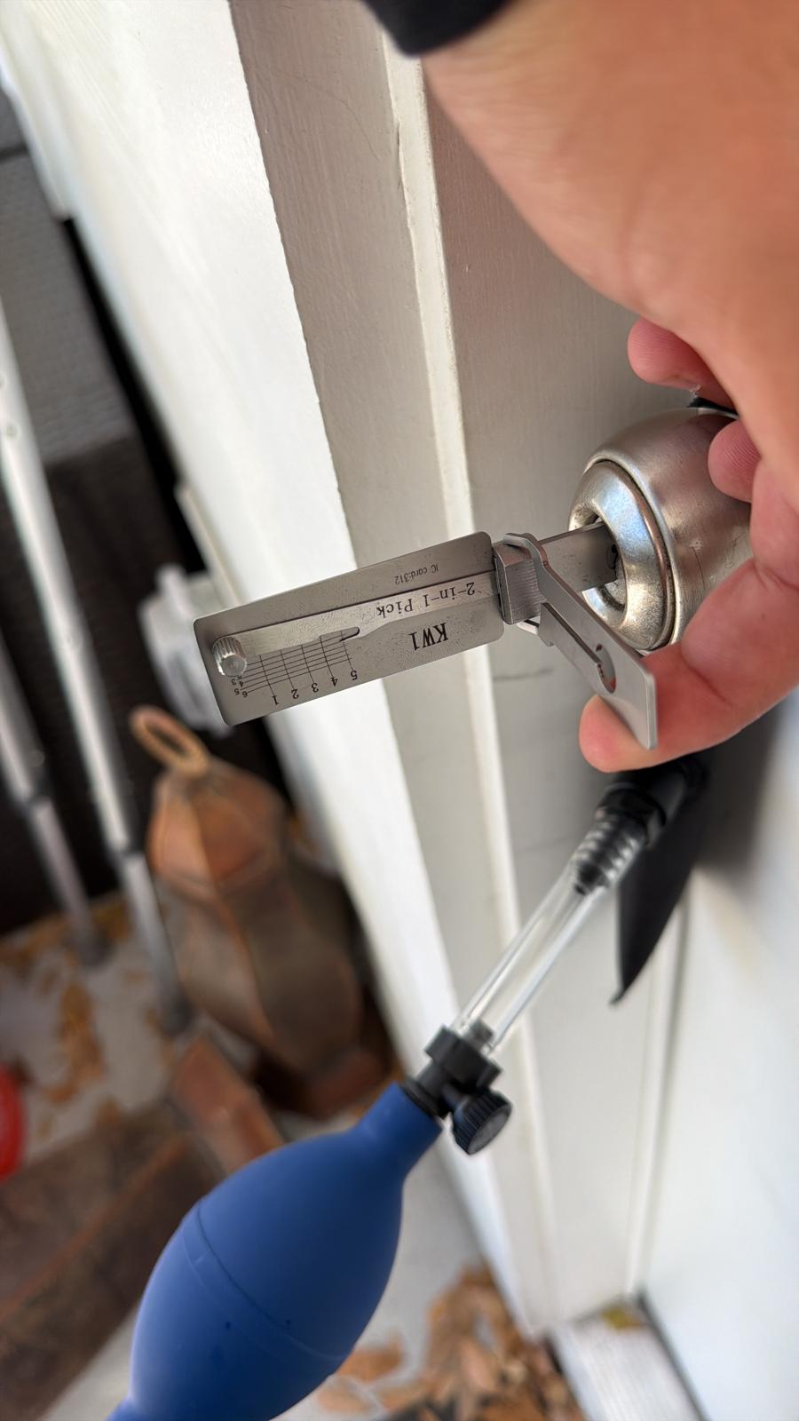 Technician using a precision 2-in-1 pick to open a residential lock without damage